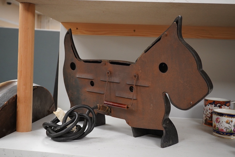 An Art Deco 1930’s Zooray Highland Terrier electric heater, 51cm wide. Condition - fair, untested